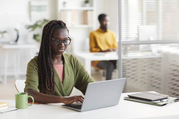 istock African-American Woman using Laptop in Office 1286022891