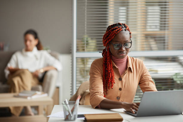 istock African-American Business Assistant Using Laptop 1286023668