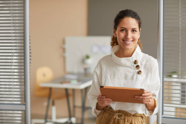 istock Modern Successful Businesswoman Smiling at Camera 1286023723
