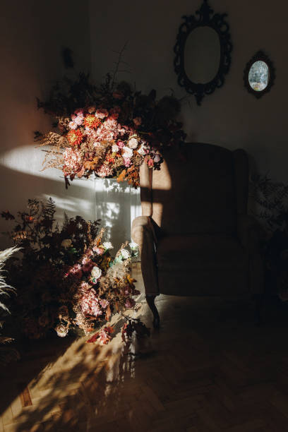 istock Brown armchair in studio room with flowers 1286025060