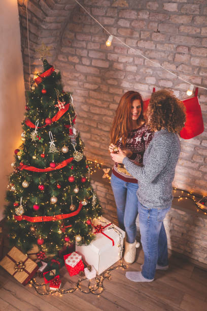 istock Couple decorating home for Christmas 1286025132