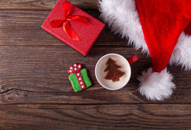 istock Christmas coffee and gingerbread cookies on rustic wooden table 1286027320