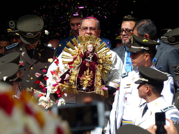 bishop carries the sculpture of niño viajero, ecuador - parade doll child baby imagens e fotografias de stock