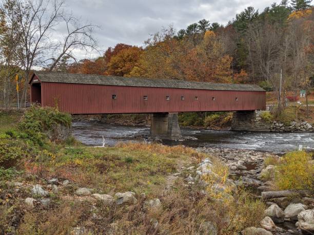 istock Red covered bridge in New England 1286027476
