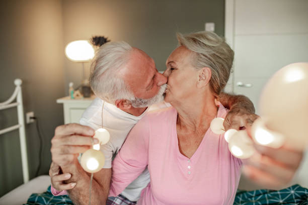 istock Senior couple spending time together at home during winter holidays 1286027478