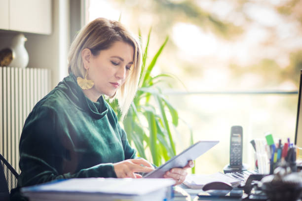 istock Business Woman using tablet at her office 1286028558