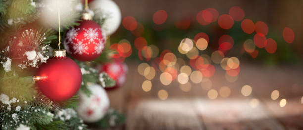 istock Christmas Tree, Red and White Ornaments against a Defocused Lights Background 1286030742