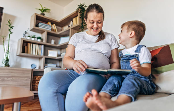 istock Pregnant woman and her son having fun 1286032536
