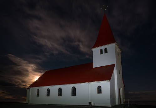 Church of town of Vik in south Iceland on a moonlight night