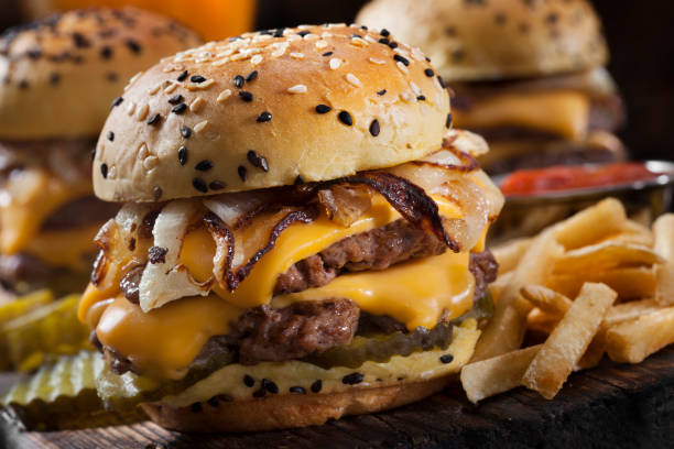 istock Double Cheese Burger Sliders with Fried Onions, Pickles on a Brioche Sesame Seed Bun 1286035667