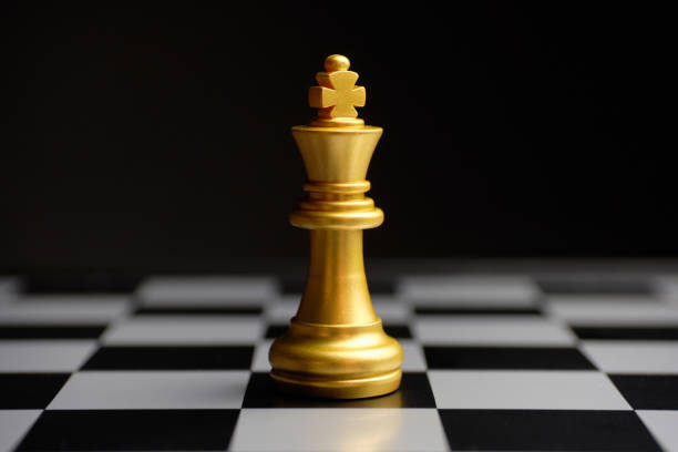istock Chess piece golden king on the board 1286039016
