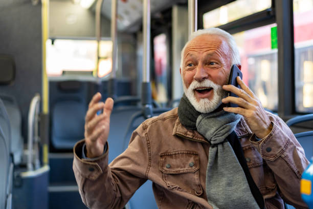 istock Mature businessman using smart phone in the public transport 1286042292