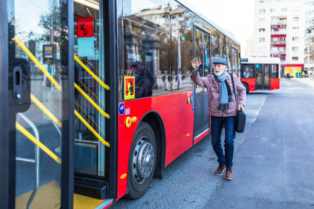 istock Mature Businessman Running To Catch Bus Stop 1286042382