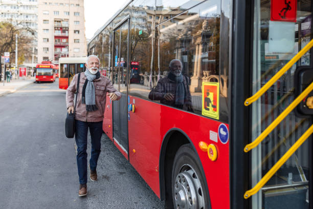 istock Mature Businessman Running To Catch Bus Stop 1286042391