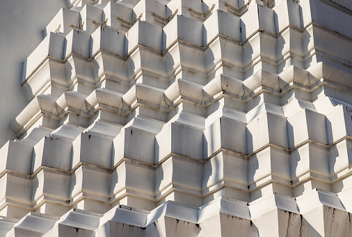 Sunlight passing through the exterior of the ancient stupa. Abstract geometric pattern with lines of stupa, copy space.