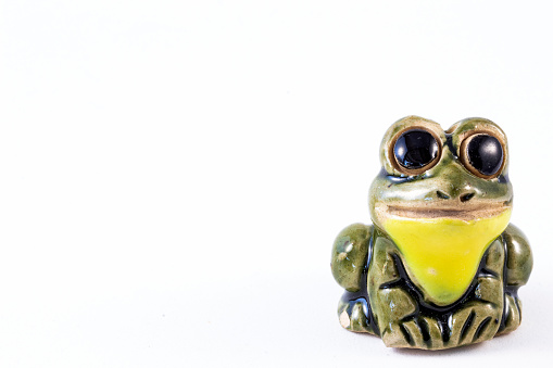 Close up of small ceramic frog