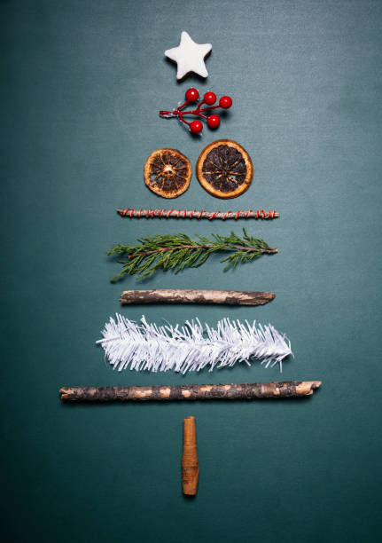 A white snowman Christmas ornament featuring a black top hat, green scarf, and silver stars dangles from red ribbons on a green pine Christmas tree. The ornament shows the snowman in a cheerful pose, with subtle details like button eyes and a carrot nose. Surrounding branches display additional holiday decorations, including red bows and other baubles, creating a festive indoor winter scene. This image captures the essence of holiday cheer and seasonal traditions, suitable for commercial uses such as greeting cards, magazine illustrations, e-commerce product displays for ornaments, social media holiday posts, and advertising for winter festivities or home decor.A white ceramic snowman ornament featuring a smiling face, black top hat, and green-and-white striped scarf dangles from a red ribbon on a green fir Christmas tree branch. Silver star accents adorn the snowman, which has black dot eyes and a carrot nose. In the blurred background, red poinsettia flowers and wrapped gifts add to the holiday scene, with warm glowing lights creating a cozy atmosphere. This image captures the whimsical charm of winter holiday decorations, suitable for commercial use in greeting cards, seasonal advertisements, editorial features on Christmas traditions, product packaging for ornaments, and lifestyle content promoting festive home decor.