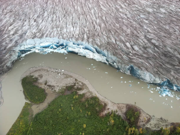 A landscape view of the glaciers and deep blue crevasses of the Juneau Icefield. Juneau, AK / United States - Sept 14, 2012: A landscape view of the glaciers and deep blue crevasses of the Juneau Icefield. alaskan icefield stock pictures, royalty-free photos & images