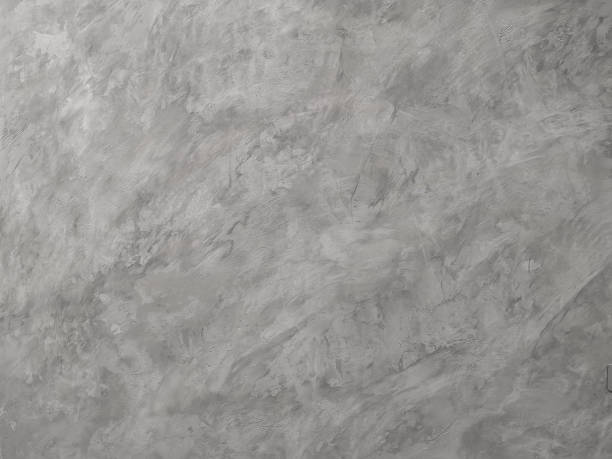 istock The lighter grey color of rough texture concrete wall skin with random pattern cement plaster on its surface 1286060937