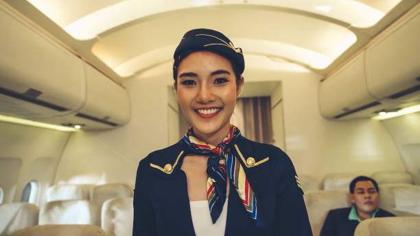 istock Cabin crew or air hostess working in airplane 1286062746