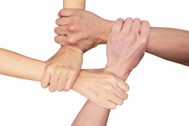 istock People of teamwork join hands together isolated white background. teamwork concept 1286064577