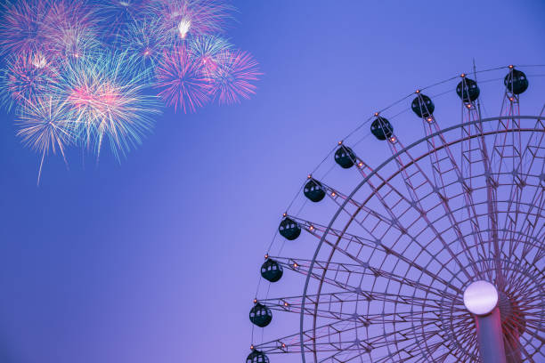 istock ferris wheel and fireworks on blue sky 1286067425