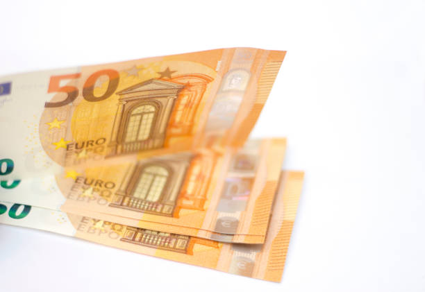 istock Stack of Fifty euro banknotes laying isolated on white background 1286072342