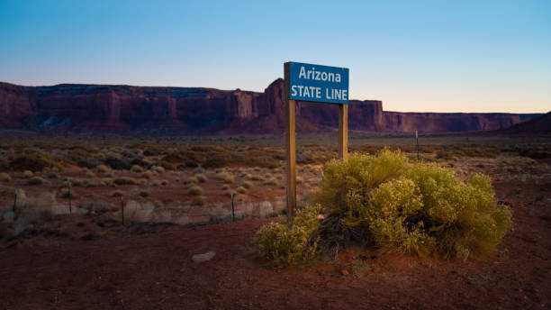 istock Road sign between Utah and Arizona state line USA 1286073355