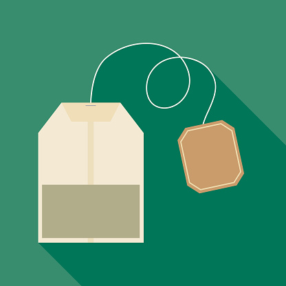 Vector illustration of a teabag with a shadow on a green background.