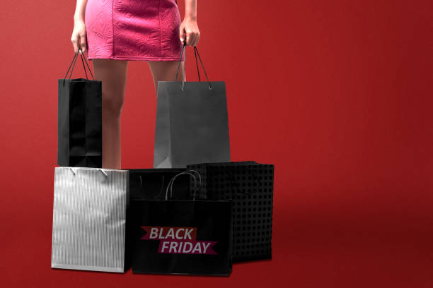 istock Women carrying a shopping bag with a colored background 1286074876