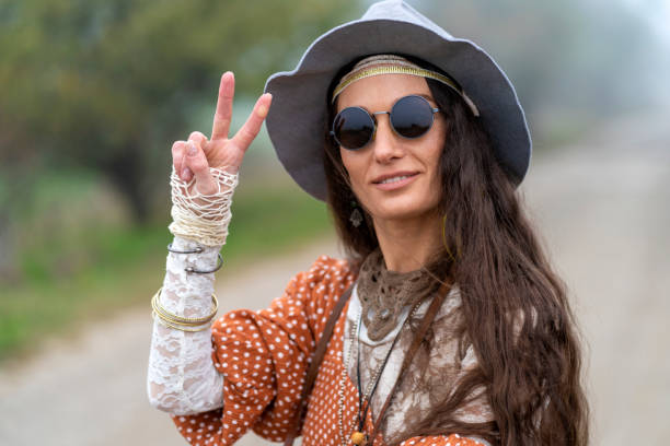 istock Beautiful hippie woman dancing in a meadow 1286074958