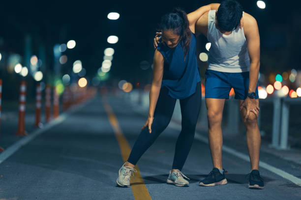 istock Asian couple, they exercise. And he was injured 1286076526