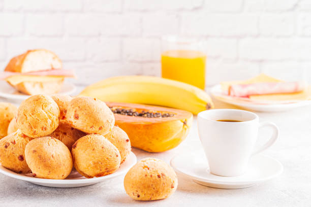 Traditional Brazilian breakfast - cheese bread, coffee, ripe fruit, selective focus