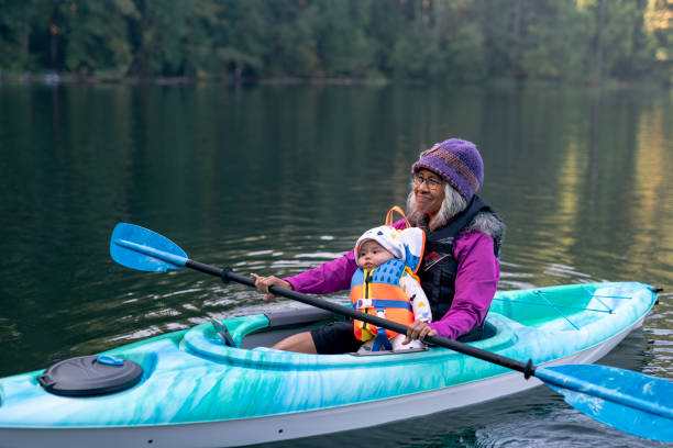 istock Pacific Islander grandmother kayaking with granddaughter 1286079883