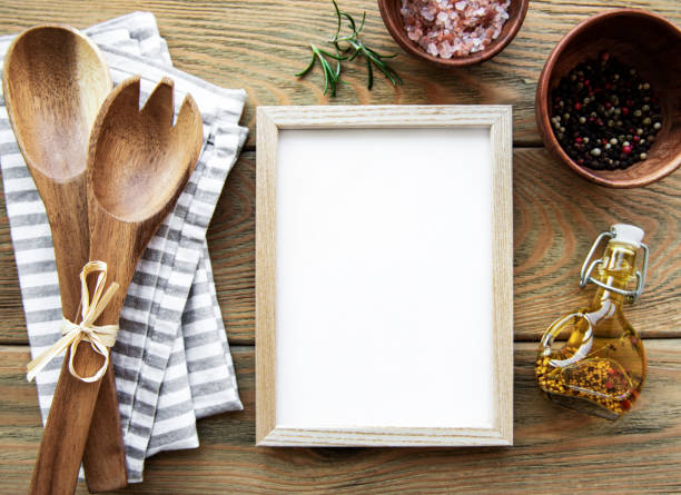 istock Old wooden kitchen utensils and spices with frame as a border 1286081676