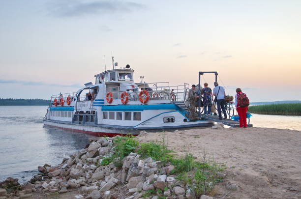 Pachkovo, Tver region, Russia - July 29, 2018: Landing people on a boat at sunset. Seliger Lake