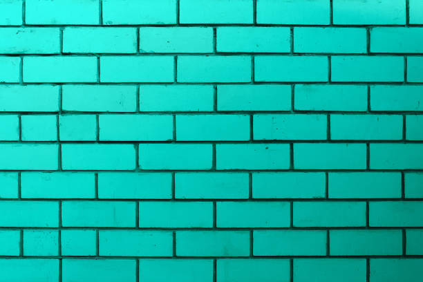 istock The brick wall is turquoise or green. Empty and clean surface with brickwork. 1286082845