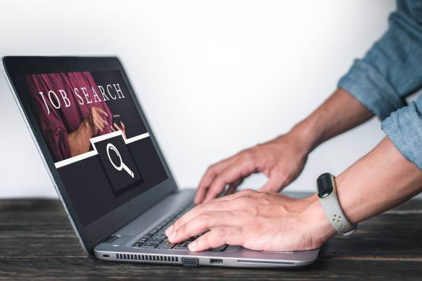 istock Businessman clicks on the Internet job search page on a computer touch screen, Networking Concept, Virtual Screen Concept. 1286086012