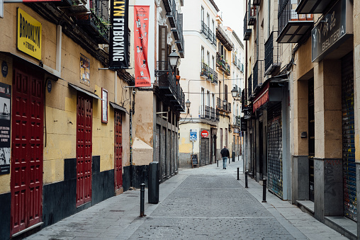 Madrid, Spain - October 2, 2020: Typical street amidst old residential buildings in the neighborhood of Lavapies