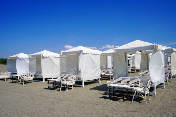 istock White beach bungalows for recreation, relaxation by the sea, ocean. 1286090689