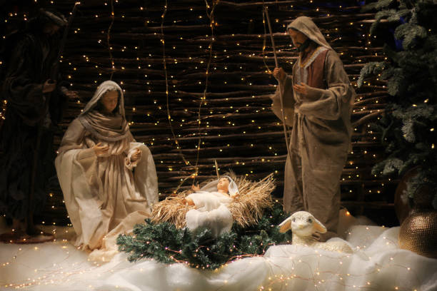 christmas manger scene with figures including jesus, mary, joseph, sheep and magi. - color image jesus christ child people imagens e fotografias de stock