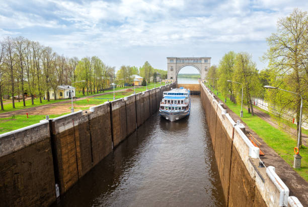 Uglich, Russia - May 10, 2019: Cruise ship Mikhail Bulgakov in the shipping lock of the Uglich hydroelectric power station on the Volga river