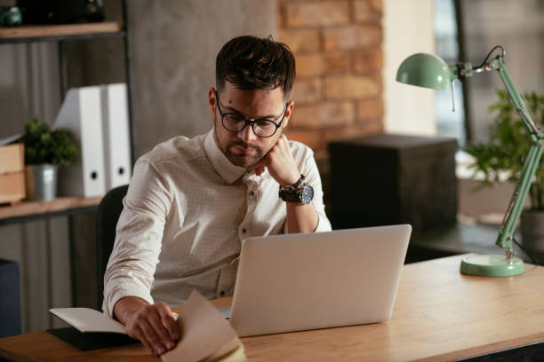 istock Businessman working in the office on his laptop. 1286092726