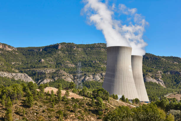 Nuclear power plant chimneys with steam. Energy industry stock photo