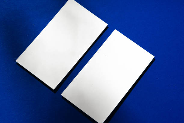 istock Two stacks of blank businesscards on blue background 1286094338