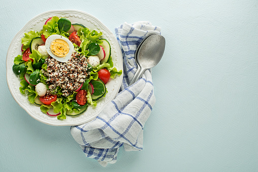 Green salad meal with quinoa seeds