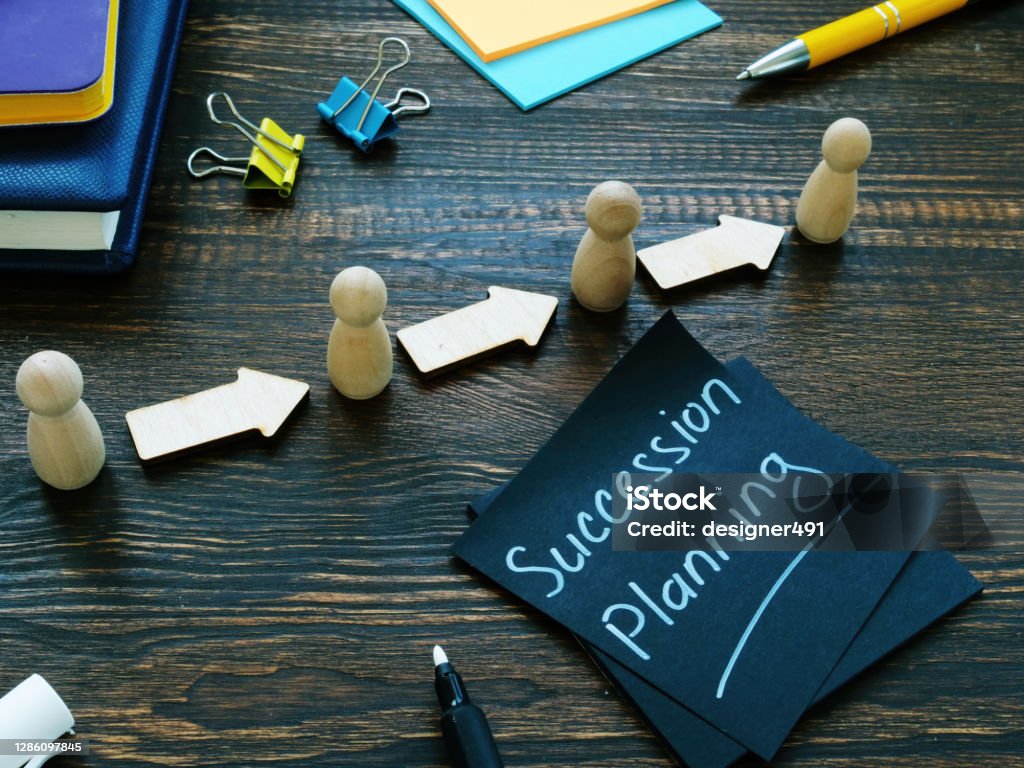 Succession planning and figurines with arrows. Succession planning sign and figurines with arrows. Planning Stock Photo
