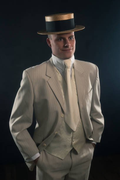 istock Edwardian style man in boater hat and suit. 1286097918