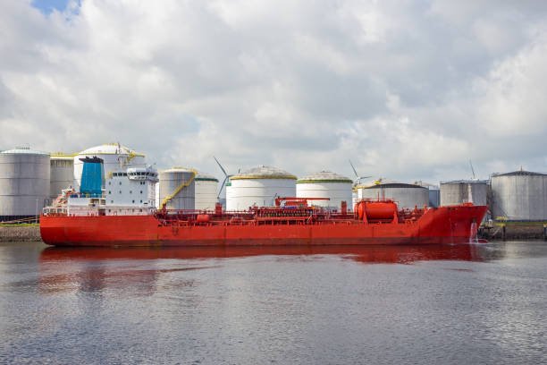 Red oil tanker moored at an silo's at an oil terminal in the Port of Rotterdam
