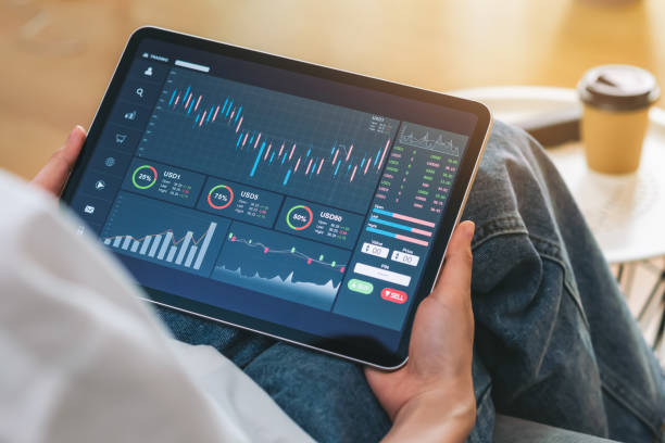 istock Stock exchange market concept, Hand trader touch on digital tablet with graphs analysis candle line on the table in house, diagrams on screen. 1286098936